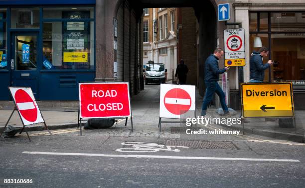 road closed and diversion signs in london - road closed stock pictures, royalty-free photos & images