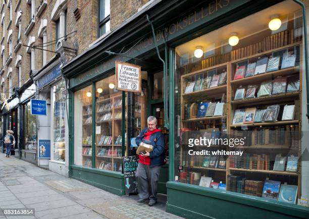 postman leaving a book shop in charing cross road, london - book shop exterior stock pictures, royalty-free photos & images