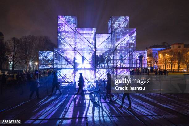 esplanade of riga amidst the light festival “staro riga”. - installation art stock pictures, royalty-free photos & images