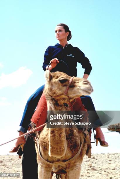 American actress Jane Fonda rides a camel on the set of the film 'Rollover' , Marrakesh, Morocco, 1981.