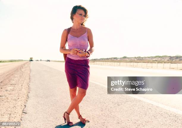 American actress Sally Field stands beside a highway in a scene from the film 'Back Roads' , California, 1980.