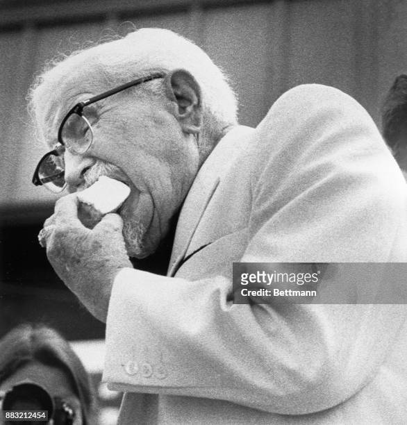 Colonel Harland Sanders celebrating his 90th birthday with a piece of cake that he claimed he couldn't eat too much of due to diabetes. Louisville...