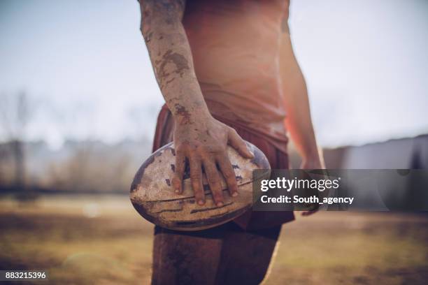 rugby player holding ball - rugby union stock pictures, royalty-free photos & images