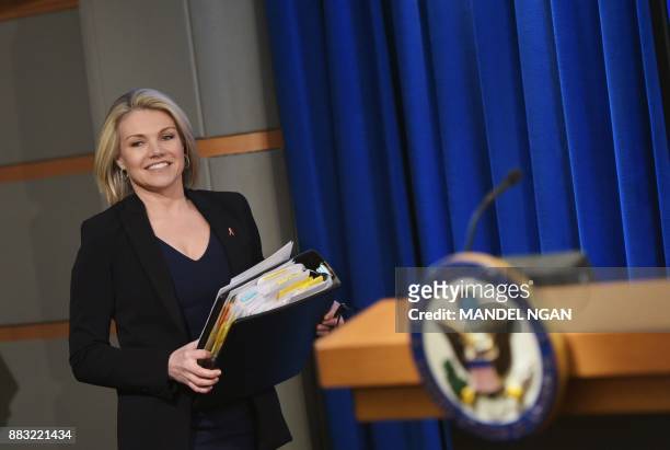 State Department Spokesperson Heather Nauert arrives for a briefing at the State Department in Washington, DC on November 30, 2017. / AFP PHOTO /...