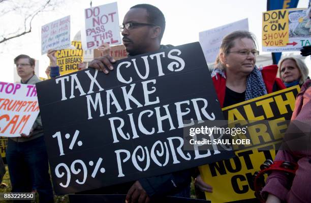 Demonstrators against the Republican tax reform bill hold a "Peoples Filibuster to Stop Tax Cuts for Billionaires," protest rally outside the US...