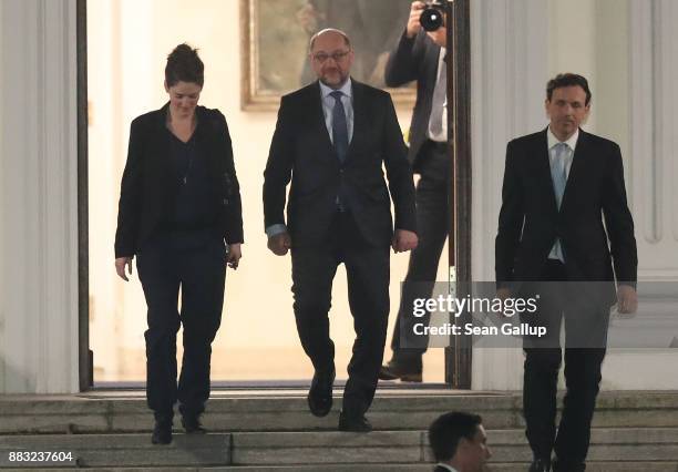 Martin Schulz , leader of the German Social Democrats , departs following a meeting of the SPD, the German Christian Democrats and the Bavarian...