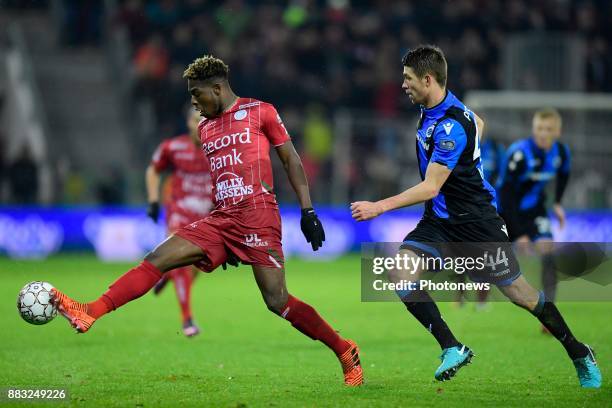 Aaron Leya Iseka forward of SV Zulte Waregem is challenged by Brandon Mechele defender of Club Brugge during the Croky Cup 1/8 final match between SV...