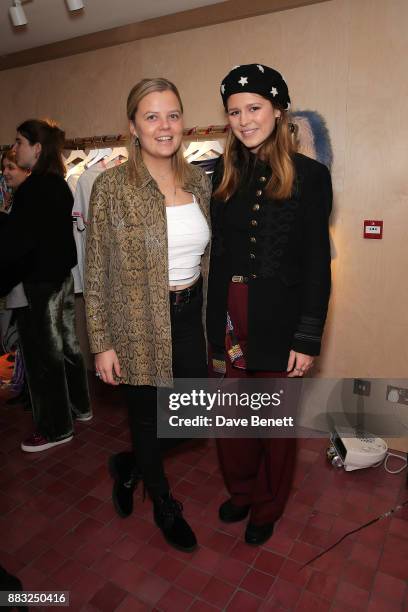 India Clevely and Carinthia Pearson attend the Cinta The Label launch party at Arty Farty Fashion Party on November 30, 2017 in London, England.