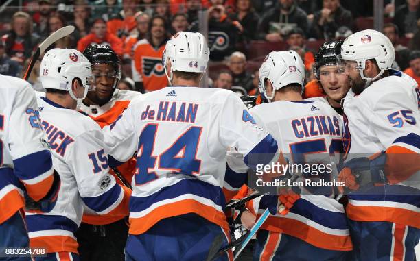 Wayne Simmonds and Nolan Patrick of the Philadelphia Flyers are involved in a scrum against Cal Clutterbuck, Calvin de Haan, Casey Cizikas and Johnny...