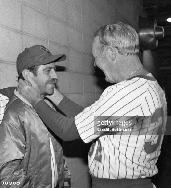 Brewers' manager Harvey Kuenn has a special caress for pitcher Mike Caldwell after victory over the Cardinals gave Milwaukee a 3-2 game lead in the...