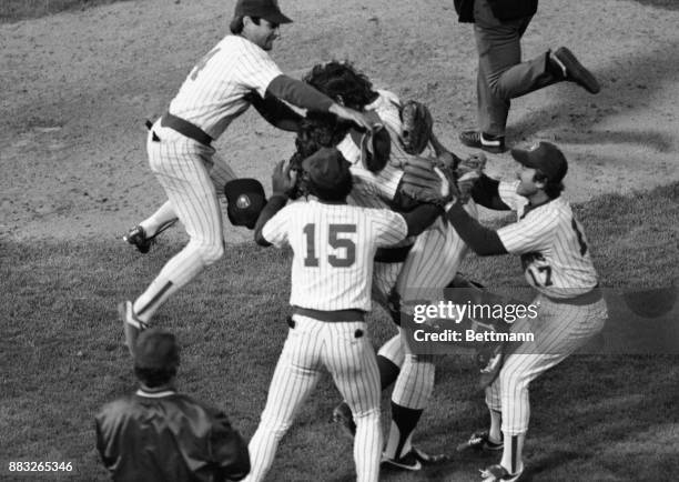 Milwaukee players leap on each other in jubilation after they beat California Angles to win the American League title. Catcher Ted Simmons leaps on...