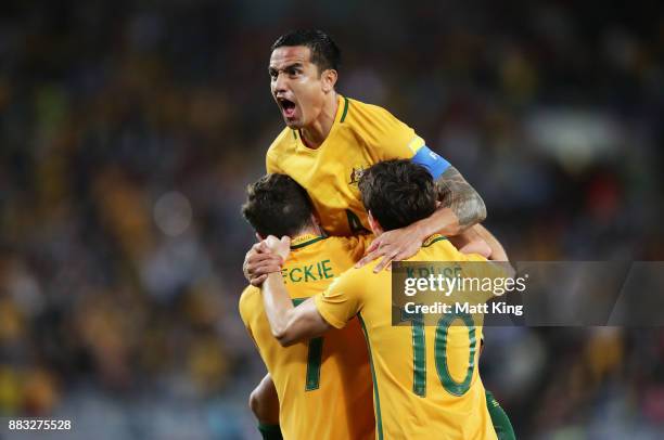 Tim Cahill of Australia celebrates scoring their first goal during the 2018 FIFA World Cup Asian Playoff match between the Australian Socceroos and...