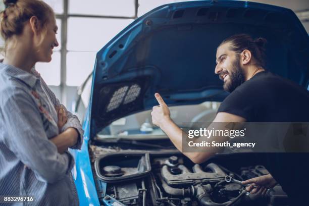 auto mechanic helping customer - garage home car repair stock pictures, royalty-free photos & images