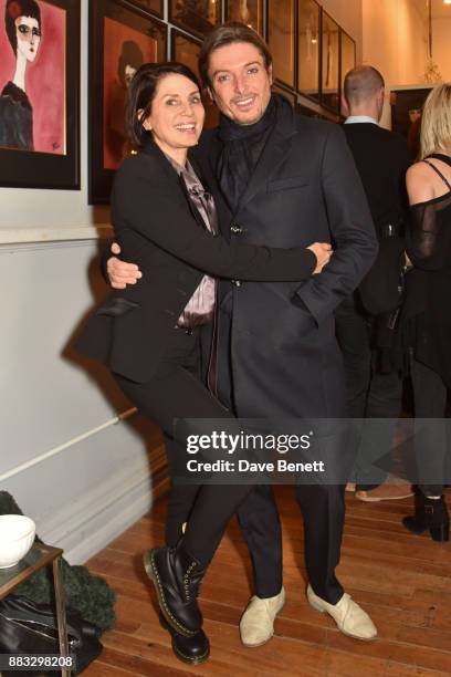 Sadie Frost and Darren Strowger attend a private view of artist Rebecca Leigh's exhibition hosted by Sadie Frost at Tann Rokka on November 30, 2017...