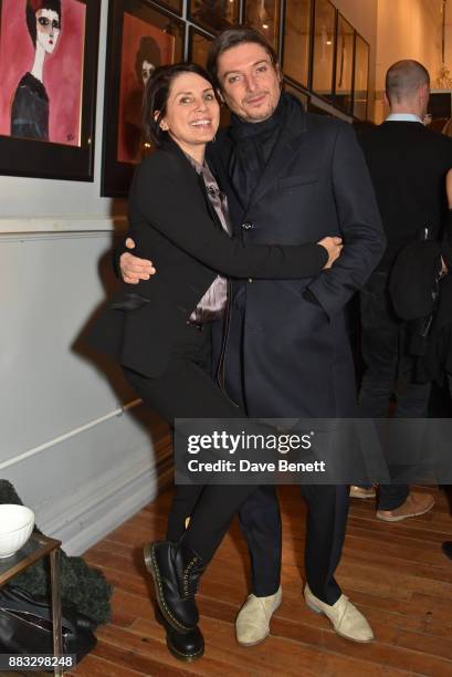 Sadie Frost and Darren Strowger attend a private view of artist Rebecca Leigh's exhibition hosted by Sadie Frost at Tann Rokka on November 30, 2017...