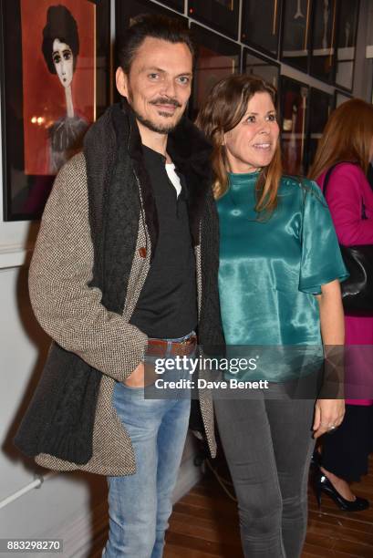 Matthew Williamson and Rebecca Leigh attend a private view of artist Rebecca Leigh's exhibition hosted by Sadie Frost at Tann Rokka on November 30,...