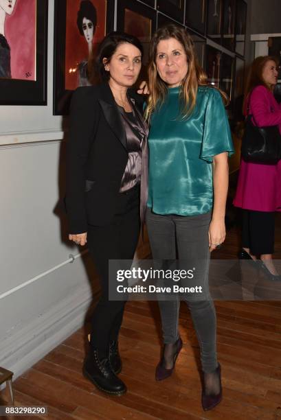 Sadie Frost and Rebecca Leigh attend a private view of artist Rebecca Leigh's exhibition hosted by Sadie Frost at Tann Rokka on November 30, 2017 in...