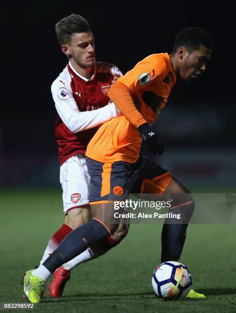 Danny Loader of Reading and Vlad Dragomir of Arsenal in action during the Premier League International Cup match between Arsenal and Reading at...