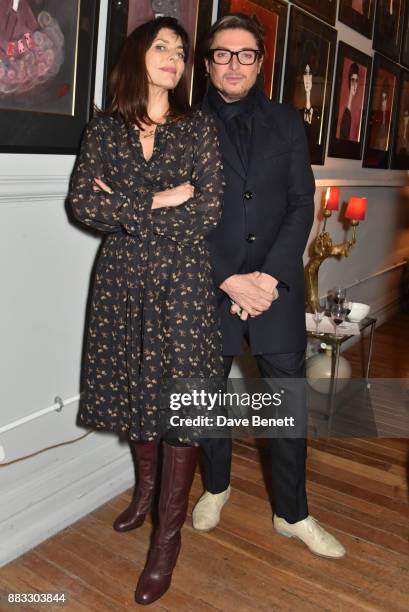 Jemima French and Darren Strowger attend a private view of artist Rebecca Leigh's exhibition hosted by Sadie Frost at Tann Rokka on November 30, 2017...