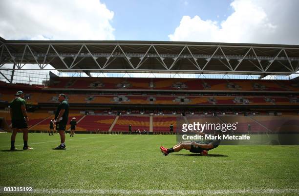 Cooper Cronk stretches during an Australian Kangaroos training session at Suncorp Stadium on December 1, 2017 in Brisbane, Australia.