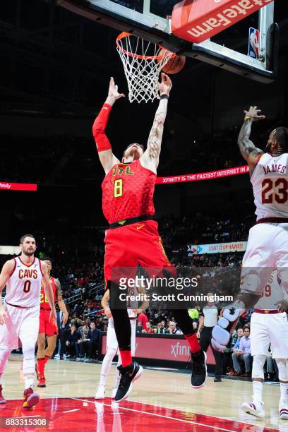 Luke Babbitt of the Atlanta Hawks goes to the basket against the Cleveland Cavaliers on November 30, 2017 at Philips Arena in Atlanta, Georgia. NOTE...
