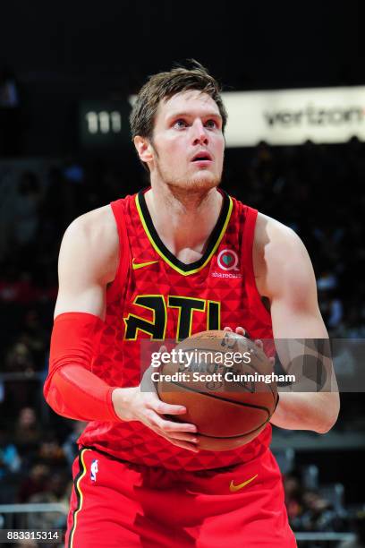 Luke Babbitt of the Atlanta Hawks shoots a free throw against the Cleveland Cavaliers on November 30, 2017 at Philips Arena in Atlanta, Georgia. NOTE...