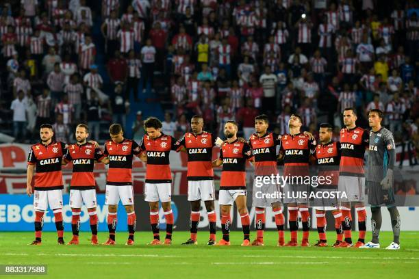 Brazil's Flamengo players hold a minute of silence in honour of the victims and survivors of Lamia flight 2933 - two days after the first anniversary...