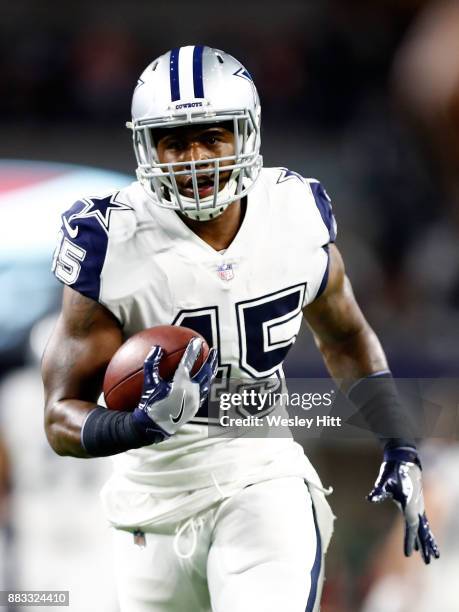 Rod Smith of the Dallas Cowboys carries the ball during warm-ups before the game against the Washington Redskins at AT&T Stadium on November 30, 2017...