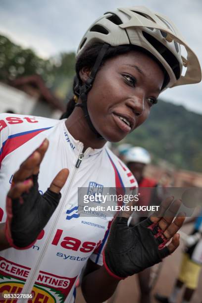 Central African cyclist Fatoumata waits prior to taking part in a weekly training session with Bangui's cycling team on October 26 in Bangui. The...