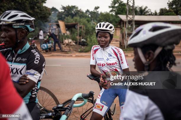 Members of Bangui's cycling team wait before taking part in a weekly training session in Bangui on October 26, 2017. The country is chronically...