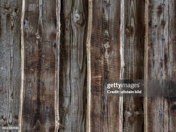 Planken einer Holzwand als Hintergrund. Altholz einer Scheune