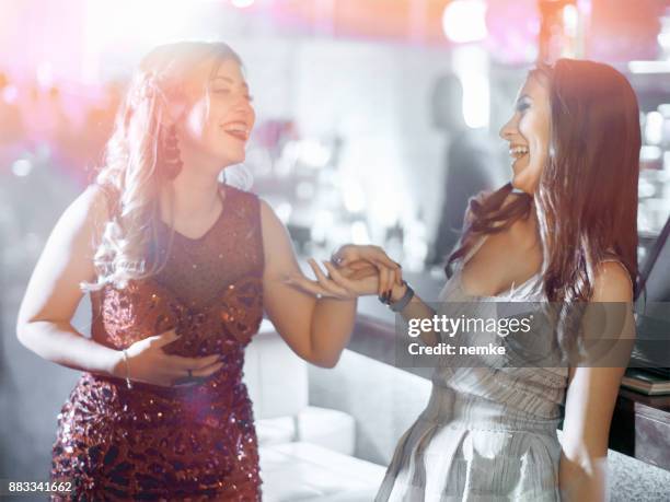 sweet 16 teen girl friends in the nightclub having fun - woman in cocktail dress stock pictures, royalty-free photos & images