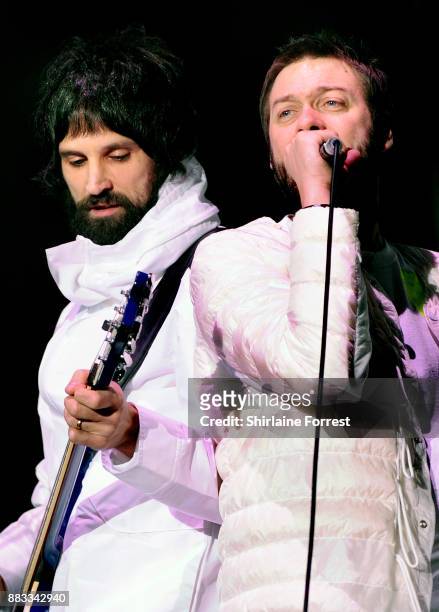 Sergio Pizzorno and Tom Meighan of Kasabian perform live on stage at Manchester Arena on November 30, 2017 in Manchester, England.