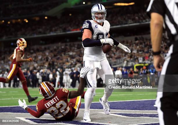 Jason Witten of the Dallas Cowboys makes a touchdown pass reception against Deshazor Everett of the Washington Redskins in the second quarter at AT&T...