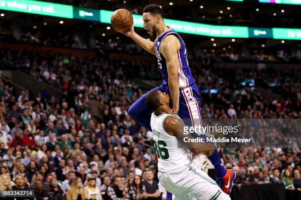 Ben Simmons of the Philadelphia 76ers runs into Marcus Smart of the Boston Celtics during the third quarter at TD Garden on November 30, 2017 in...