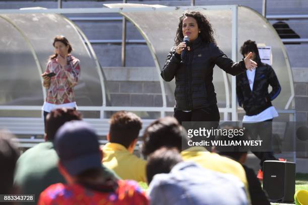 Photo taken on September 14 shows Honey Thaljieh , a corporate communications manager for football's world governing body FIFA, speaking to youths...