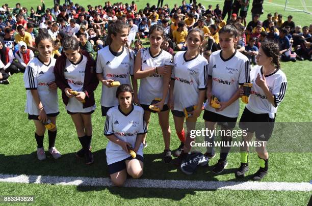 Photo taken on September 14 shows refugee Sarah Glaoo aged 17, with teammates after a football match organised by Football United, a programme...