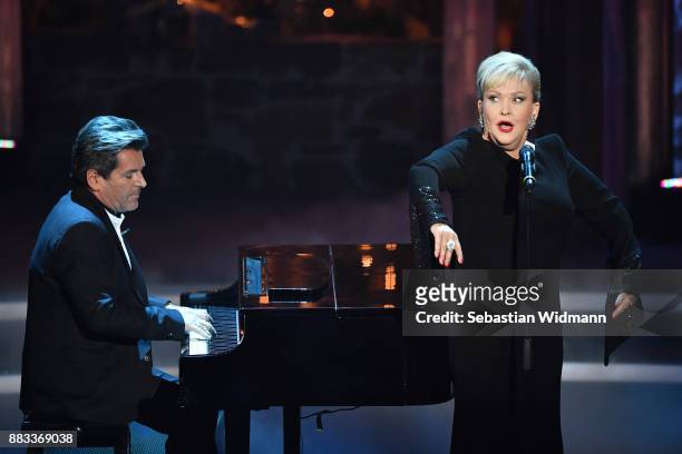 Angelika Milster and Thomas Anders perform during the tv show 'Heiligabend mit Carmen Nebel' on November 29, 2017 in Munich, Germany. The show will...