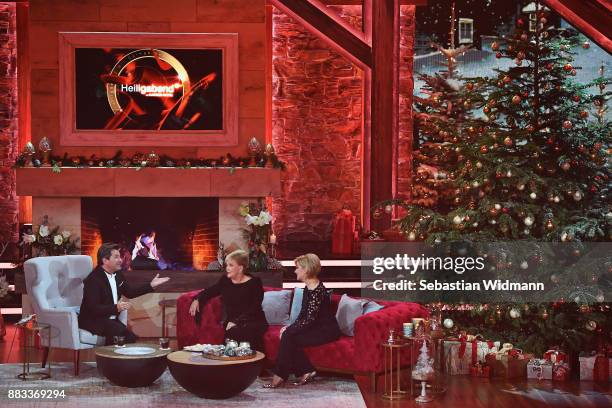 Thomas Anders, Angelika Milster and Carmen Nebel talk during the tv show 'Heiligabend mit Carmen Nebel' on November 29, 2017 in Munich, Germany. The...