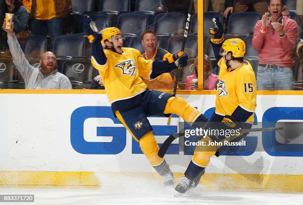 Craig Smith celebrates his goal with Anthony Bitetto of the Nashville Predators against the Vancouver Canucks during an NHL game at Bridgestone Arena...