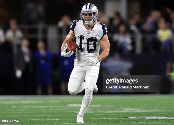 Ryan Switzer of the Dallas Cowboys runs for a 83-yard touchdown punt return against the Washington Redskins in the second quarter at AT&T Stadium on...