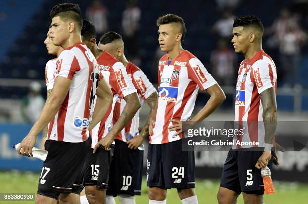 Jorge Arias, Victor Cantillo and Rafael Perez of Junior look dejected after a second leg match between Junior and Flamengo as part of the Copa...