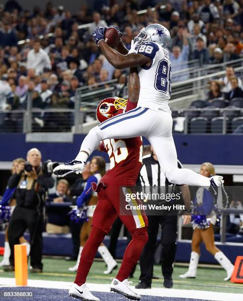 Dez Bryant of the Dallas Cowboys makes a touchdown reception against Bashaud Breeland of the Washington Redskins in the fourth quarter of a football...