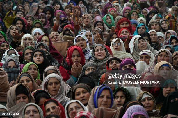 Kashmiris react as a priest displays a relic believed to be a hair from the beard of Prophet Muhammed during Eid-e-Milad-un-Nabi, the birthday of the...