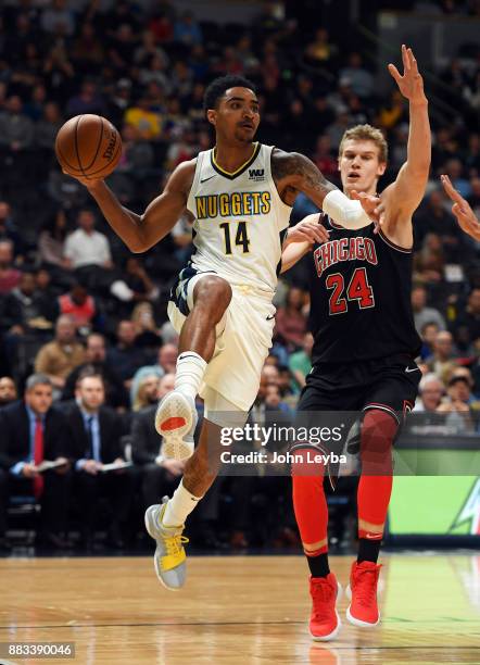 Denver Nuggets guard Gary Harris looks to pass the ball on Chicago Bulls forward Lauri Markkanen during the first quarter against the Chicago Bulls...