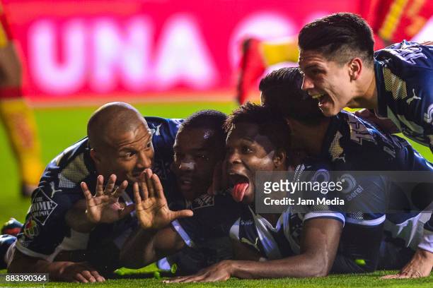 Aviles Hurtado of Monterrey celebrates with teammates after scoring the first goal of his team during the semifinal first leg match between Morelia...
