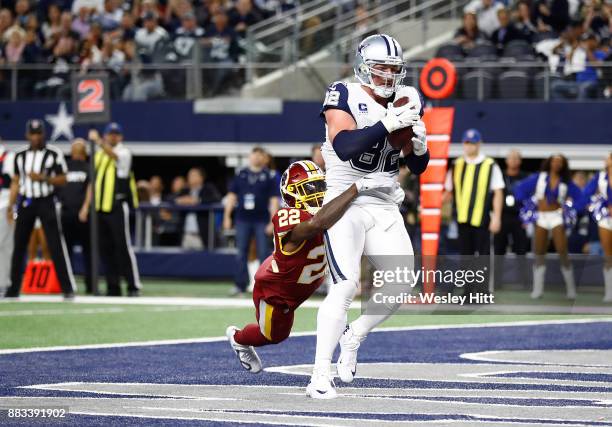 Jason Witten of the Dallas Cowboys makes a touchdown pass reception against Deshazor Everett of the Washington Redskins in the second quarter at AT&T...