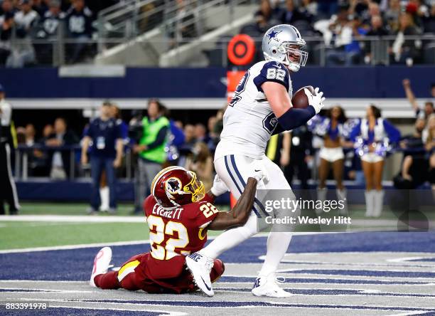 Jason Witten of the Dallas Cowboys makes a touchdown pass reception against Deshazor Everett of the Washington Redskins in the second quarter at AT&T...