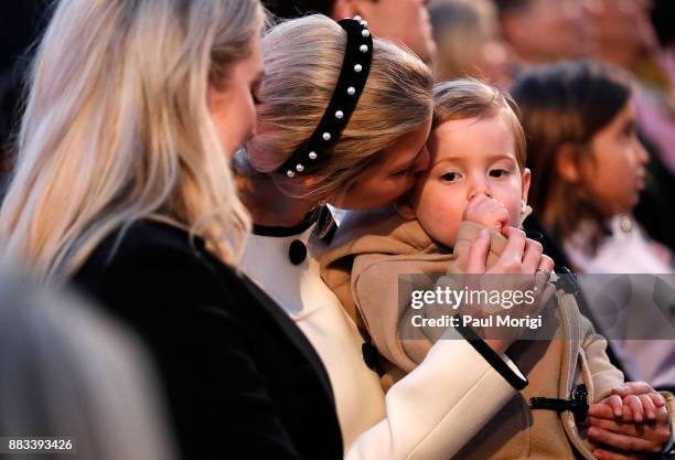 Ivanka Trump gives her son Theodore a kiss on the cheek at the 95th Annual National Christmas Tree Lighting Ceremony in President's Park on November...