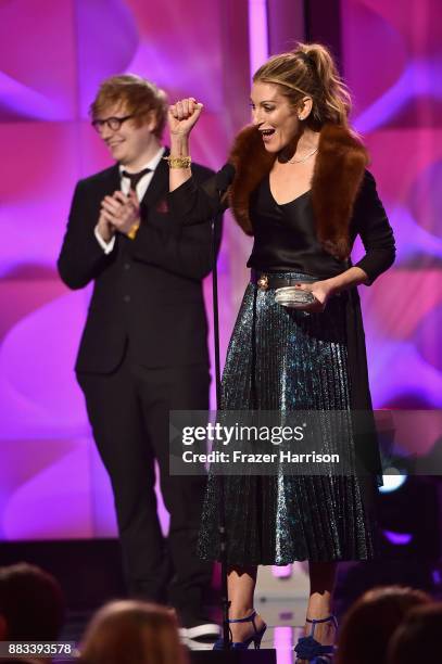 Honoree Julie Greenwald accepts the Executive of the Year Award from Ed Sheeran onstage during Billboard Women In Music 2017 at The Ray Dolby...